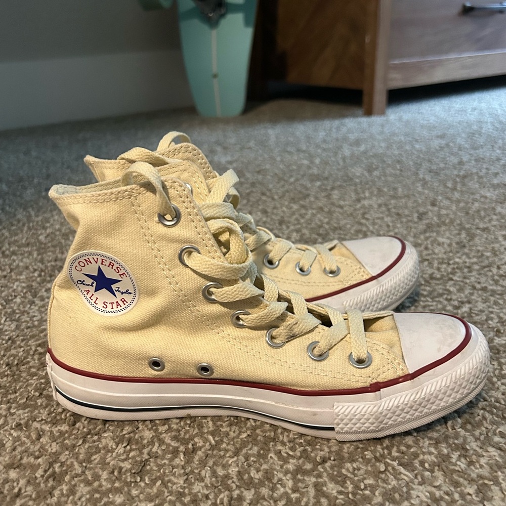 Yellow converse high top sneakers